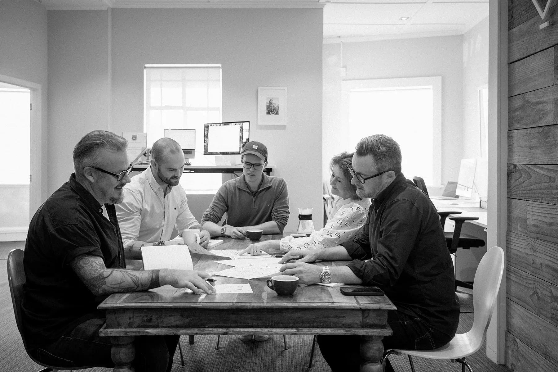 The Caretakers team having a meeting